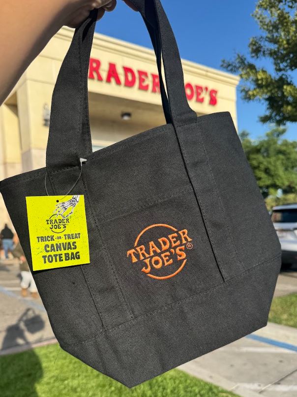 Black Halloween mini canvas tote with black handles and orange Trader Joe’s logo