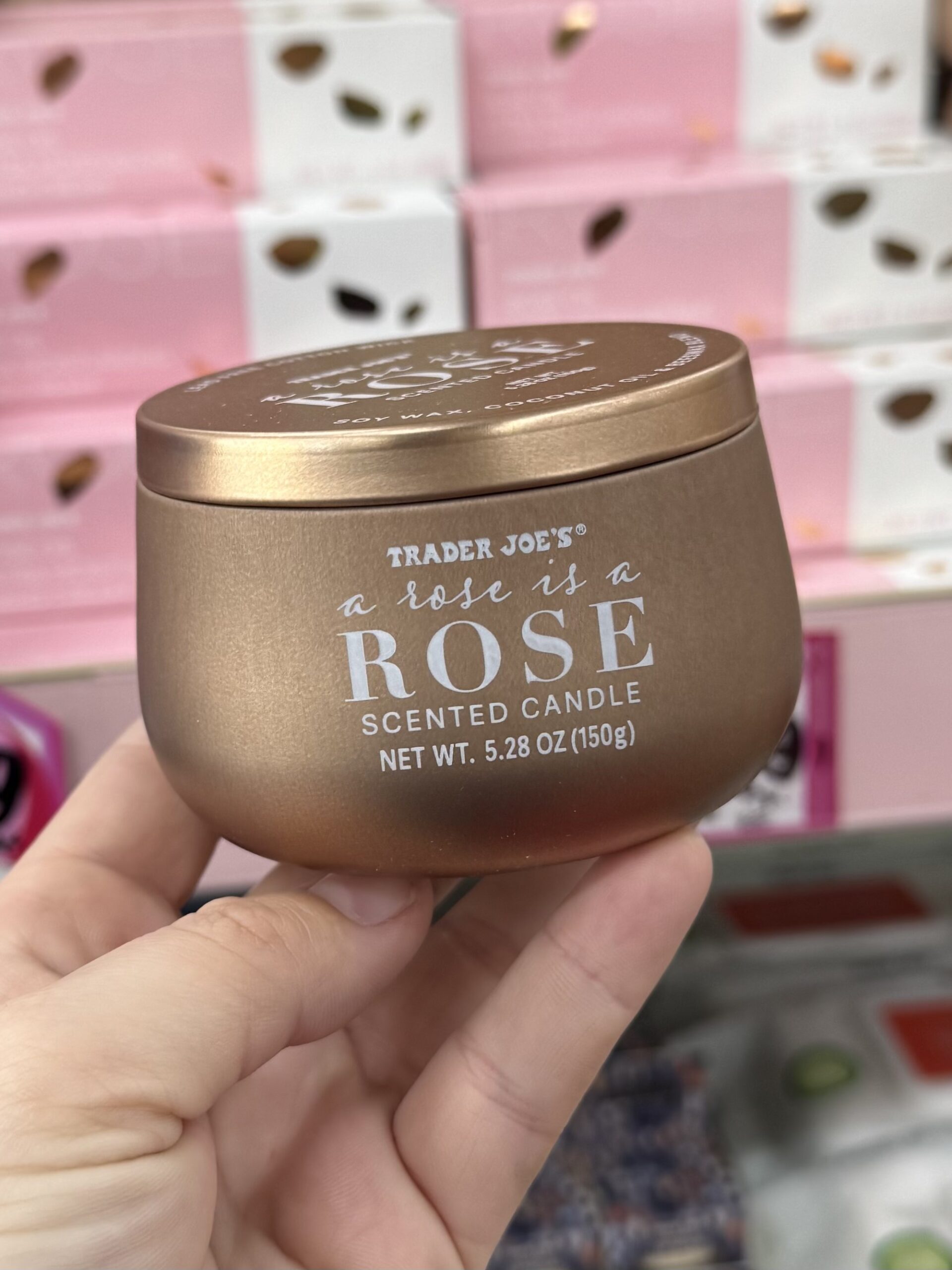 a rose is a ROSE SCENTED CANDLE - in store